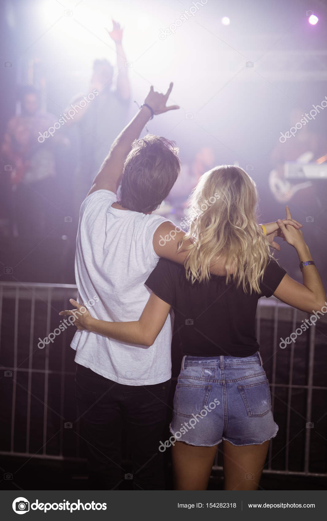 Couple enjoying at nightclub — Stock Photo © Wavebreakmedia #154282318