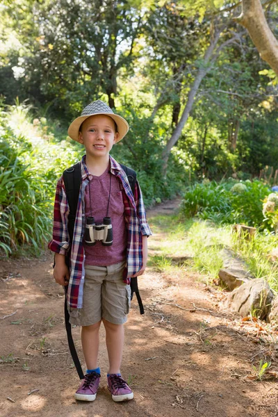 Boy standing in the forest — Stock Photo, Image