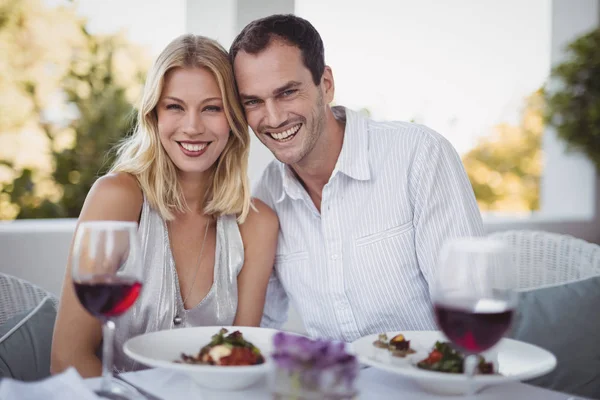 Couple sitting together in restaurant — Stock Photo, Image