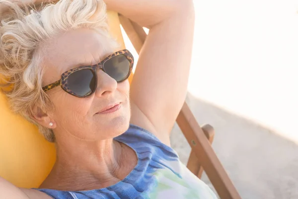 Senior woman relaxing on chair — Stock Photo, Image