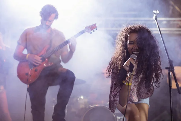 Cheerful female singer with male guitarist — Stock Photo, Image