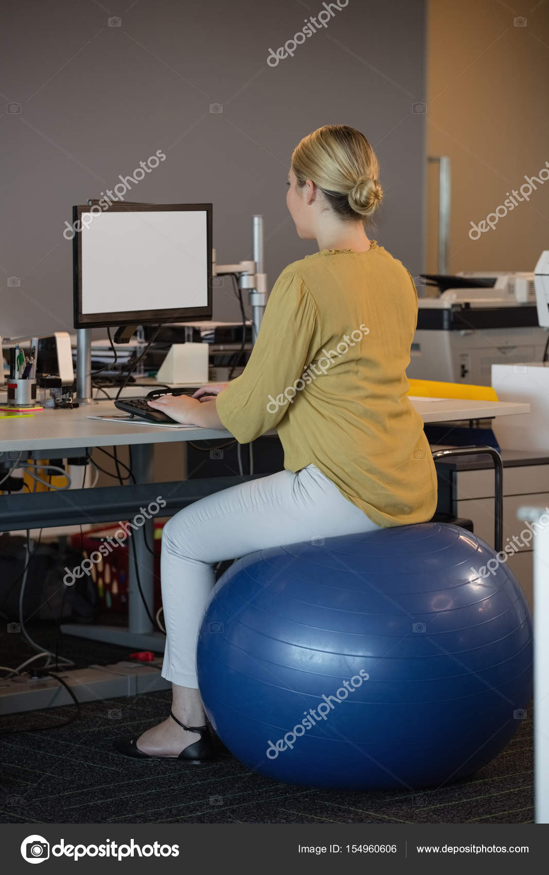 Executive Sitting On Exercise Ball Stock Photo C Wavebreakmedia
