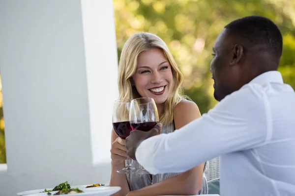 Couple toasting wineglasses at restaurant — Stock Photo, Image