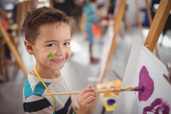 Schoolboy panting on canvas — Stock Photo, Image