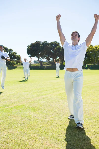 Cricket players enjoying victory — Stock Photo, Image