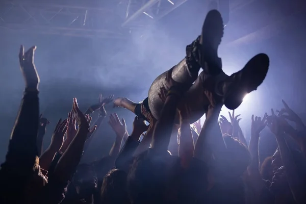 Crowd surfing at a concert — Stock Photo, Image