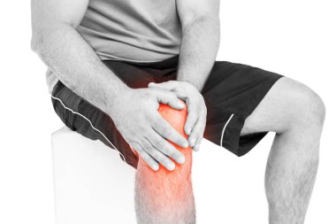 Man holding sore knee clipart