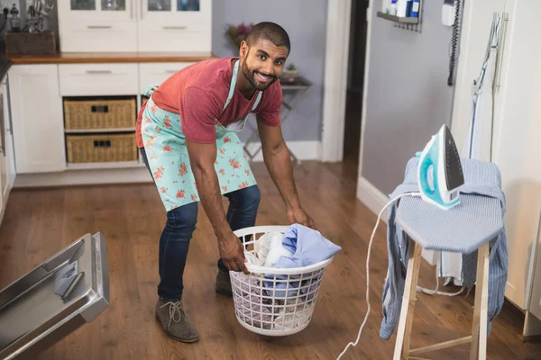man holding laundry basket