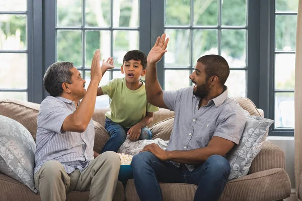 Multi-generation family giving high five — Stock Photo, Image