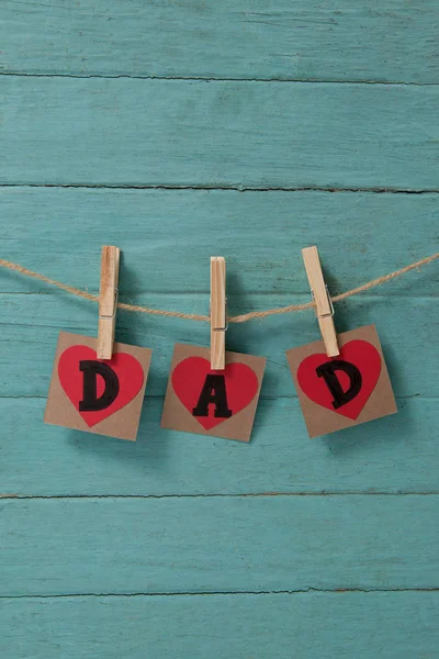 Dad text in heart shapes hanging — Stock Photo, Image