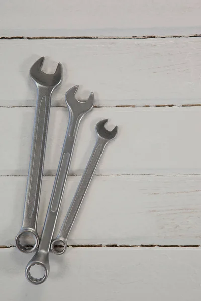 Wrenches on white wooden table — Stock Photo, Image