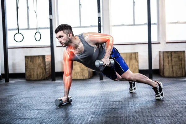Homem forte fazendo exercícios físicos — Fotografia de Stock