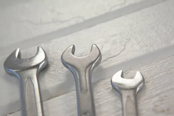 Wrenches on white table — Stock Photo, Image