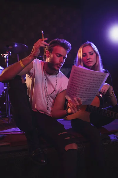 Musicians practicing with music sheets — Stock Photo, Image