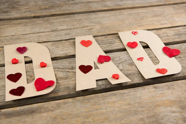 Decorated dad text on wooden table — Stock Photo, Image