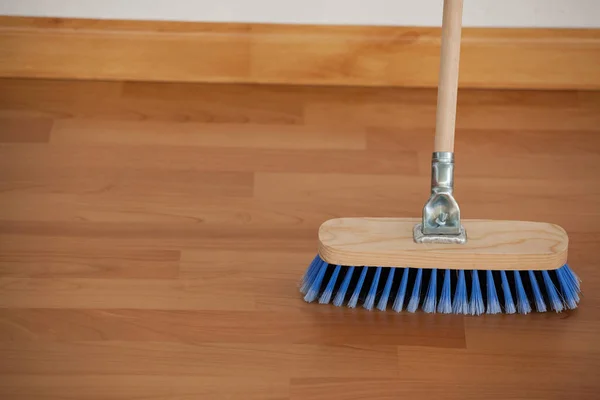 Sweeping broom with wooden handle — Stock Photo, Image