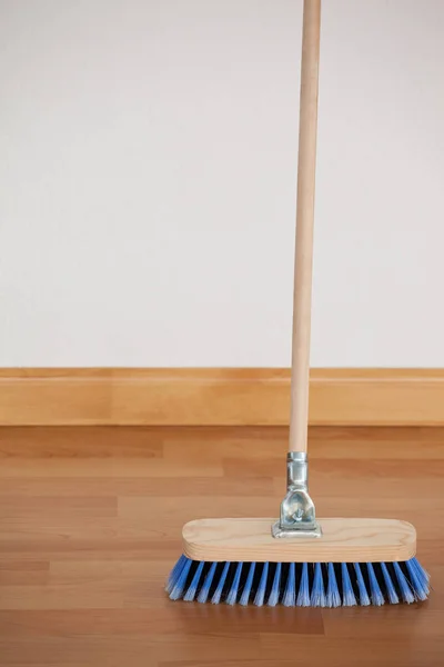 Sweeping broom with wooden handle — Stock Photo, Image