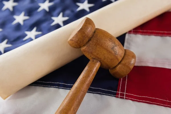 Gavel and rolled-up document — Stock Photo, Image