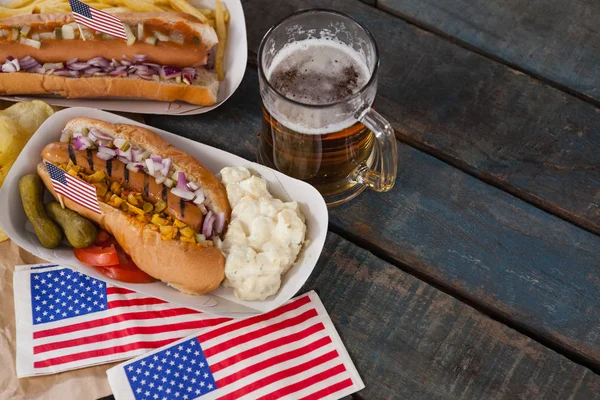 Hot dogs and glass of beer — Stock Photo, Image