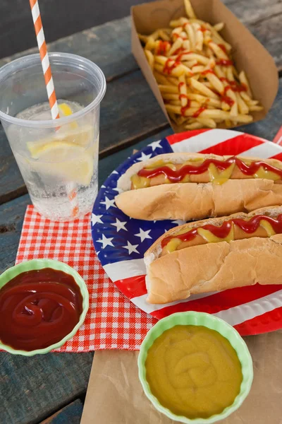 Hot dogs served on plate Royalty Free Stock Photos