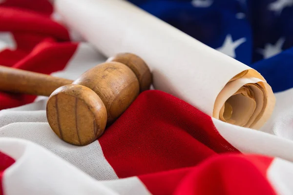 Gavel and rolled-up document — Stock Photo, Image