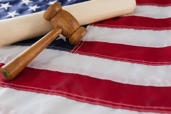 Gavel and rolled-up document — Stock Photo, Image