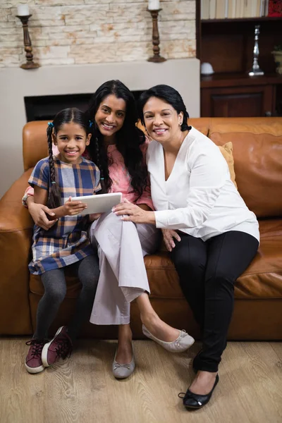 Multi-generation family using tablet — Stock Photo, Image