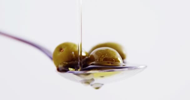 Olive oil being poured on olives — Stock Video