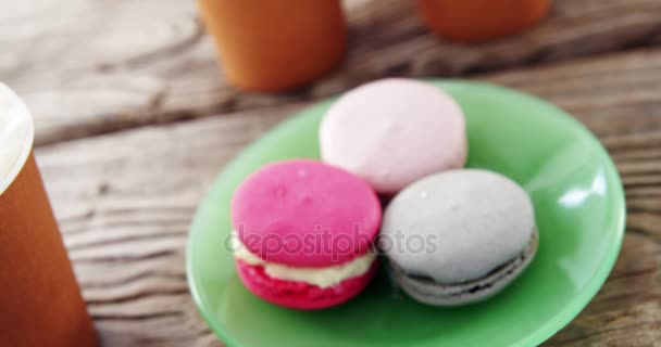 Colorful macaroon cookies in plate — Stock Video