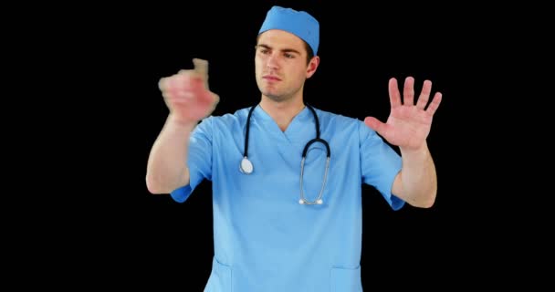 Surgeon pretending to be using futuristic digital screen — Stock Video