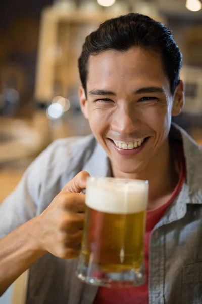 Man having beer in a restaurant — Stock Photo, Image