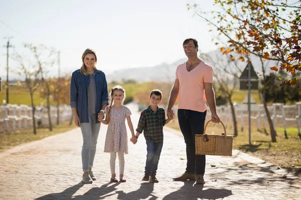 Family in the park on a sunny day — Stock Photo, Image