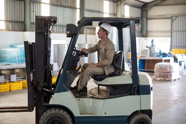 Worker driving forklift — Stock Photo, Image
