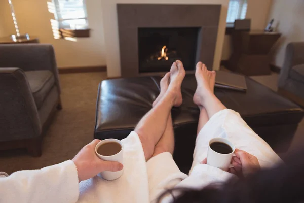Couple relaxing while having coffee — Stock Photo, Image