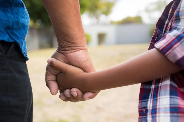 Boy and grandfather holding hands — Stock Photo, Image