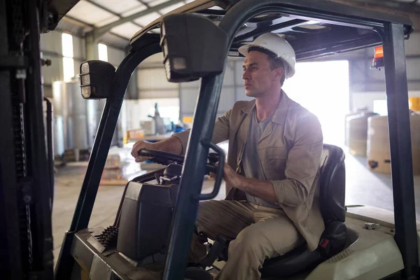 Worker driving forklift — Stock Photo, Image