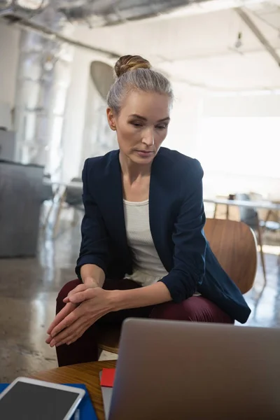 Thoughtful businesswoman looking down — Stock Photo, Image