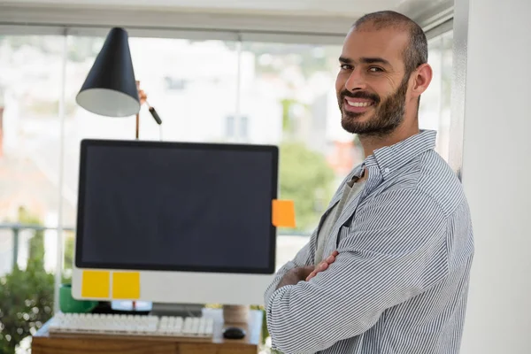 Designer with arms crossed standing — Stock Photo, Image