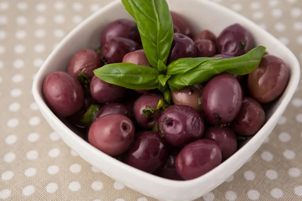 Brown olives with herb — Stock Photo, Image