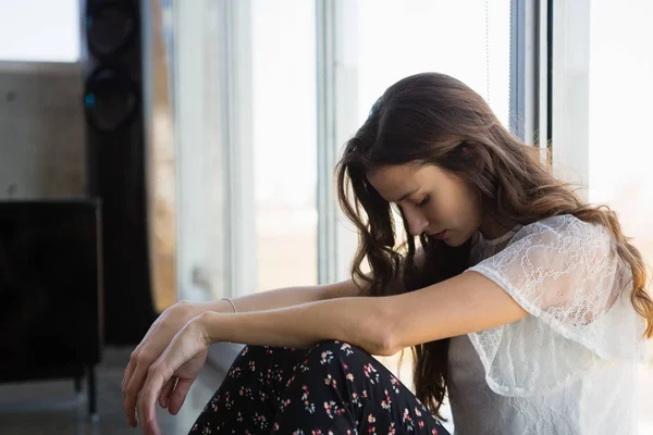 Tired businesswoman looking down — Stock Photo, Image