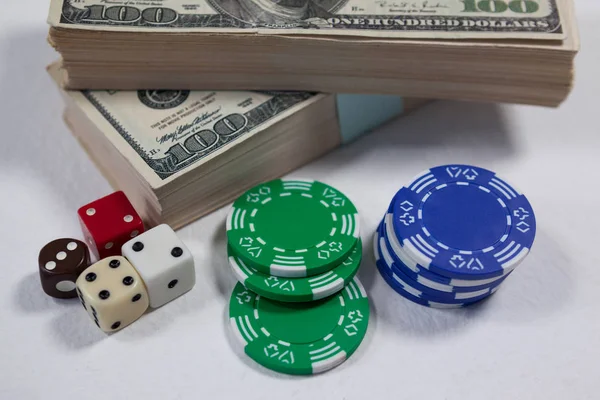 Dollars with dice and casino chips — Stock Photo, Image