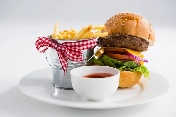 Hamburger and french fries with tomato sauce — Stock Photo, Image