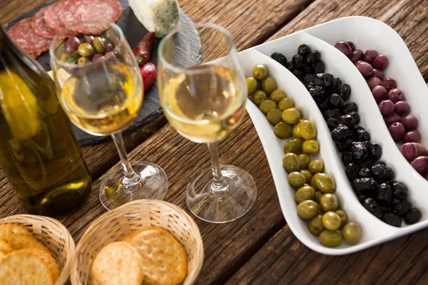 Marinated olives with bottle of wine — Stok Foto