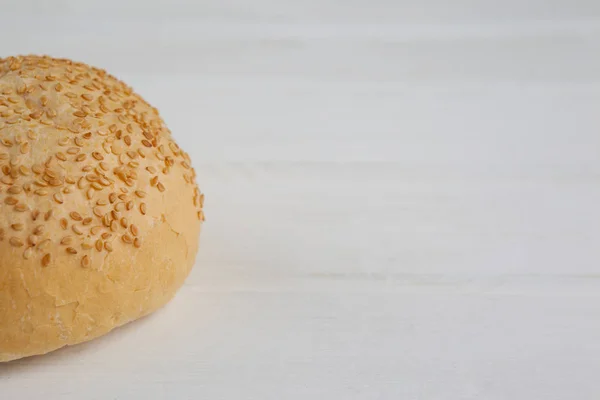 Bun on wooden table — Stock Photo, Image