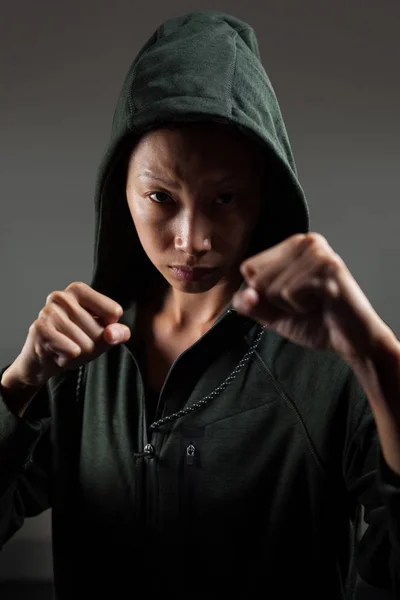 woman practicing boxing in fitness studio