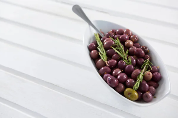 Olives garnished with rosemary — Stock Photo, Image