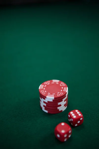 Pairs of dice and casino chips — Stock Photo, Image