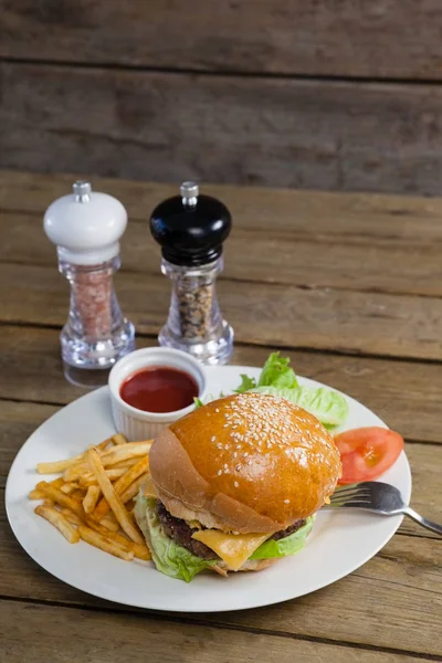 Burger with french fries and sauce — Stock Photo, Image