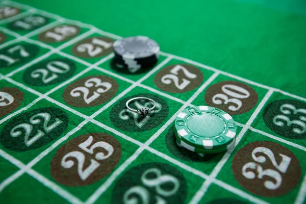 Ring and casino chips — Stock Photo, Image
