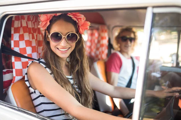 Smiling woman driving camper van — Stock Photo, Image